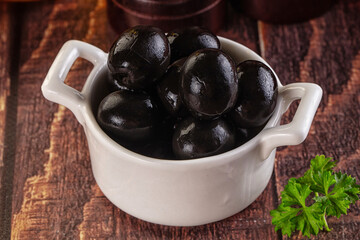 Mediterranean marinated Black olives in the bowl