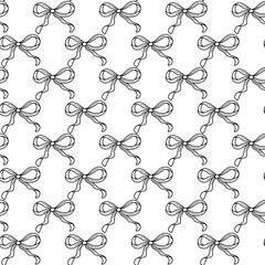 Fototapeta premium Seamless Pattern of Decorative Ribbon Bows in Black and White Design. A repeating pattern of elegant ribbon bows drawn in black and white. The symmetry and intricate design make it suitable for use 