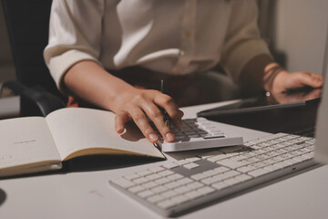 Expert woman asian female people review data number costing managerial account prepare monthly...