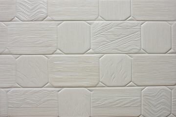Textured White Ceramic Tile Arrangement Featuring Rectangular and Octagonal Geometric Shapes