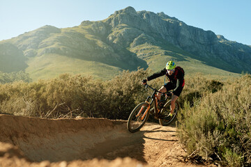 Cycling, mountain bike and view with man outdoor for adrenaline, adventure or training. Exercise,...