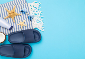 Blue beach accessories on color background, top view. Copy space for text