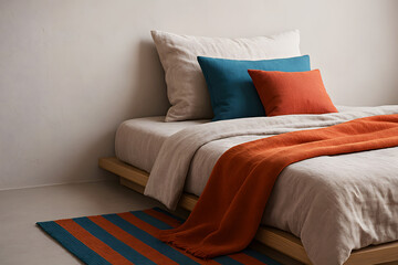Japandi bedroom detail with linen textures and color accents