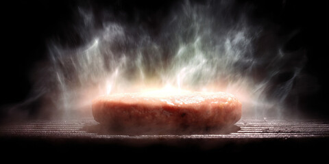 Raw Hamburger Patty on Grill with Steam