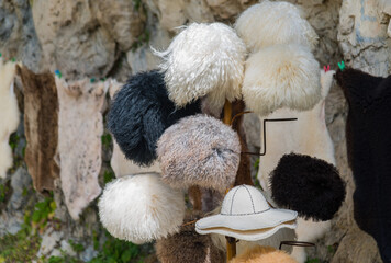 Traditional fur hats and skins for sale at a market. North Caucasus Russia