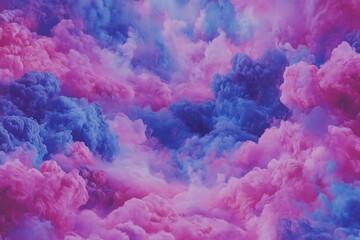 Fototapeta premium Vibrant pink and blue clouds create a dreamy atmosphere in a whimsical sky during sunset