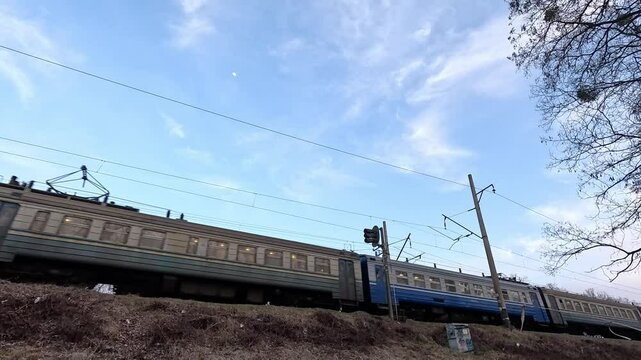 The electric train travels along the railway.