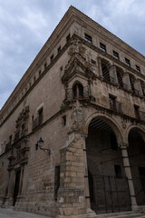 Jabalquinto palace showing stone arches and ornate facade in baeza, spain