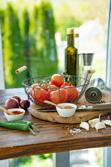Fresh ingredients for marinades and sauces. Preparing salads and spicy sauces for grilling. Tasty side dishes for meat and vegetables. Vertical kitchen scene.