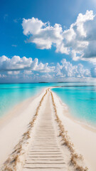 Fototapeta premium A wooden pathway stretches across a sandbar, leading into the clear turquoise waters, under a vibrant sky.