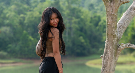 Thai Girl in casual dress at beach and countryside in Thailand