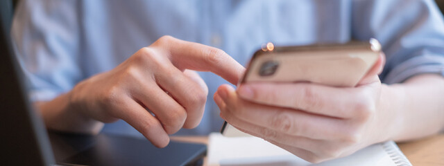 Close-up business hand holding using smartphone technology communication modern lifestyle concept