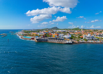 Obraz premium Rif Fort aerial view with modern stores at the mouth of Sint Anna Bay in Otrobanda, city of Willemstad, Curacao. Historic Willemstad is a UNESCO World Heritage Site. 
