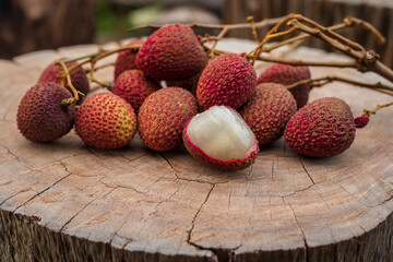 Fresh Lychee fruit on a wooden floor. Fruit background.
