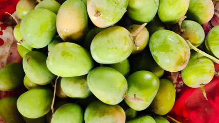 Handpicked fresh raw mangoes with a vibrant green skin, perfect for pickles, chutneys, and traditional Indian recipes. A summer favorite across the subcontinent.