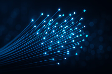 Obraz premium A visually stunning representation of fiber optic cables, showcasing glowing blue lights against a dark background, symbolizing speed, innovation, and the future of communication.