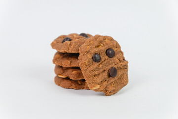A close-up of a stack of freshly baked chocolate chip cookies made with wholesome ingredients, isolated on a white background, perfect for promoting delicious treats and gourmet dessert concepts