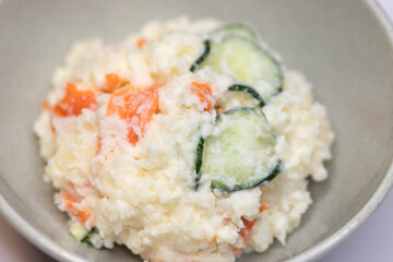 Close-up of Japanese potato salad with cucumber and carrot