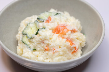 Close-up of Japanese potato salad with cucumber and carrot