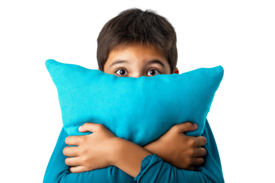 young child with shy expression peeking over blue pillow isolated on white transparent background