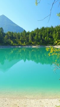 Urisee with green alpine water and mountains view