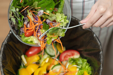 Food waste environment concept, people throwing food garbage into bin prepare to decompose.