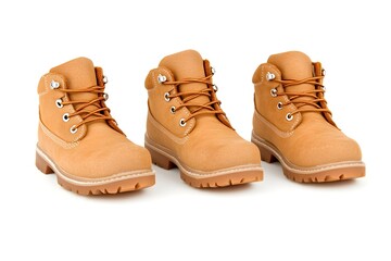Three tan work boots with laces, arranged in a row against a white background