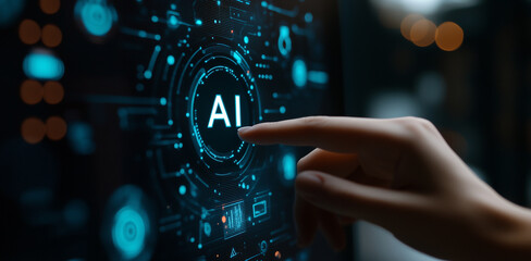 Human hand touches AI icon on monitor