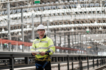 engineer Sitting in depot and inspection railway . construction worker on railways. Engineer work...
