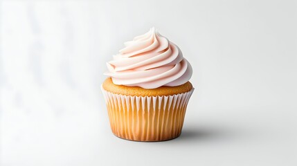 A single vanilla cupcake with light pink frosting, swirled on top, sits on a white background