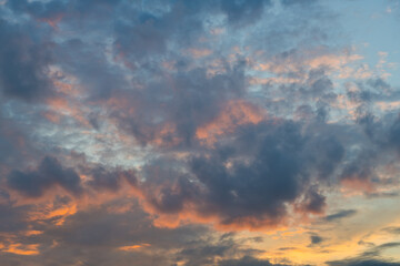 Pink and grey clouds in the sunset sky