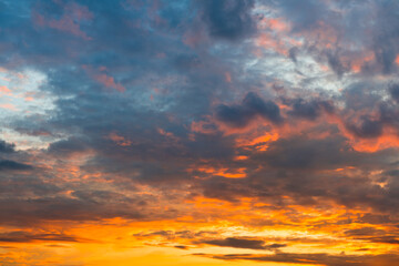 Pink, orange and grey clouds in the sunset sky