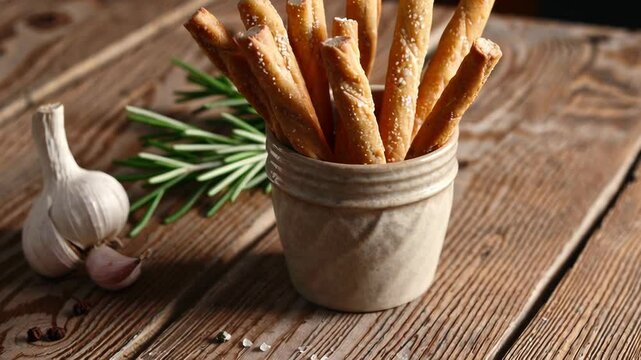Artisan Breadsticks with Rosemary and Garlic on Rustic Background