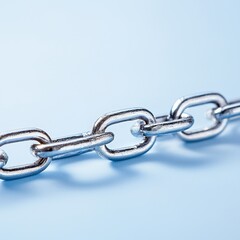Elegant metal chain displayed on a vibrant blue background highlighting its intricate links and design