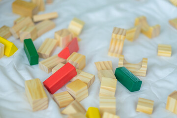 Portrait of kid cute asian boy playing a blocks wood game. selective focus. Copy space. Executive Functions Concept.
