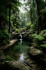 Fototapeta premium Hidden jungle cascade surrounded by prehistoric ferns