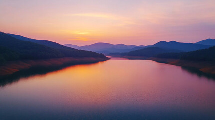 Fototapeta premium Serene mountain lake dawn view from above, soft pink and orange sky, clear blue water, mountains reflection, high-resolution 8k, sharp focus, natural lighting, National Geographic style