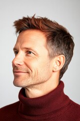 Fototapeta premium Graphic visual design of style for aging men. Fashionable men's textured crop haircut - midlife white man with red hair. Pure white solid background. A relaxed and poised man showing grace.
