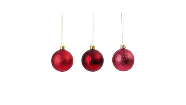 Three Red Glitter Christmas Ornaments Hanging on Gold Strings