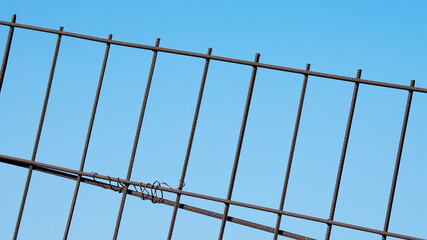 tilted metal grate against blue sky