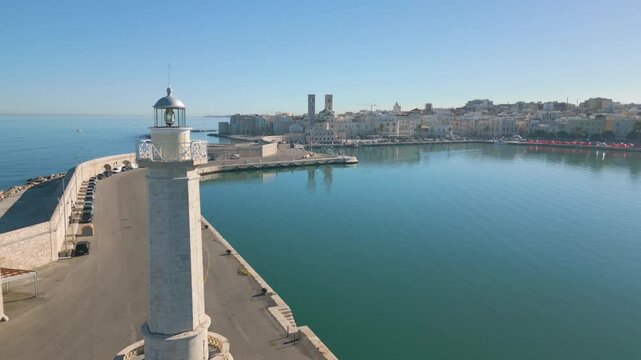 Aerial drone video of the lighthouse in the harbour of Molfetta in Italy.