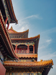 Fototapeta premium Ancient Chinese architecture of Lama Temple in Beijing under blue sky and white clouds