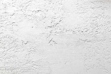 A white wall with a rough texture