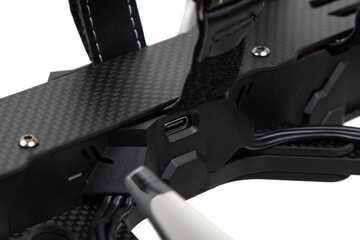 USB-C port on FPV drone carbon frame close-up