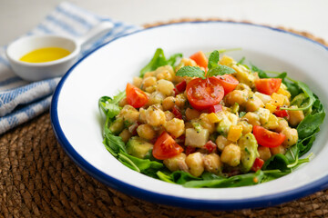 Mediterranean chickpea salad with avocados and vegetables.