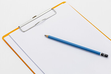 Essential tools for the Workplace: A minimalist studio shot of a pristine clipboard paired with a finely sharpened pencil, symbolizing clarity, organization, and the pursuit of excellence.