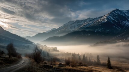 Obraz premium Serene Misty Mountain Landscape at Dawn with Fog and Mountains