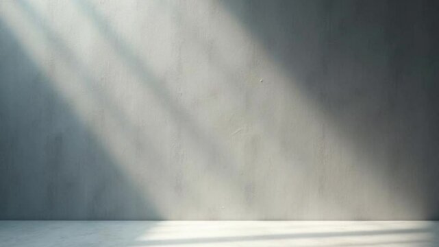 Gray concrete wall with sunlight shining through a window. Suitable for background design, real estate listings, construction websites, and architectural presentations.