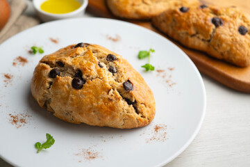 Fototapeta premium Triangular English scones with dark chocolate chips.
