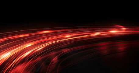 Abstract image featuring flowing red light trails against a dark background.